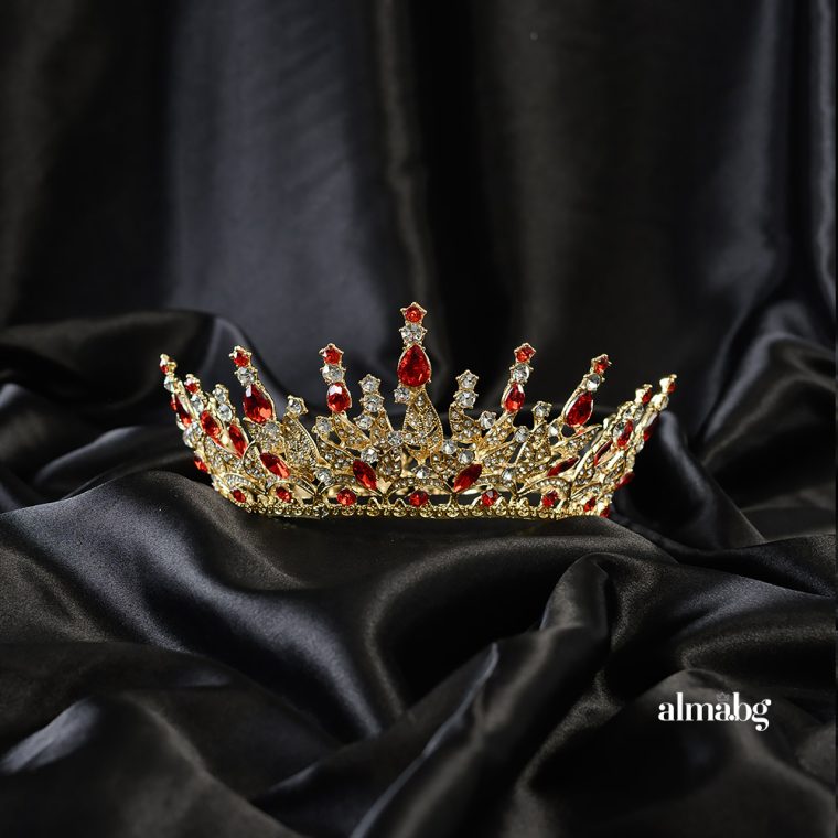 Crown with gold base and red stones