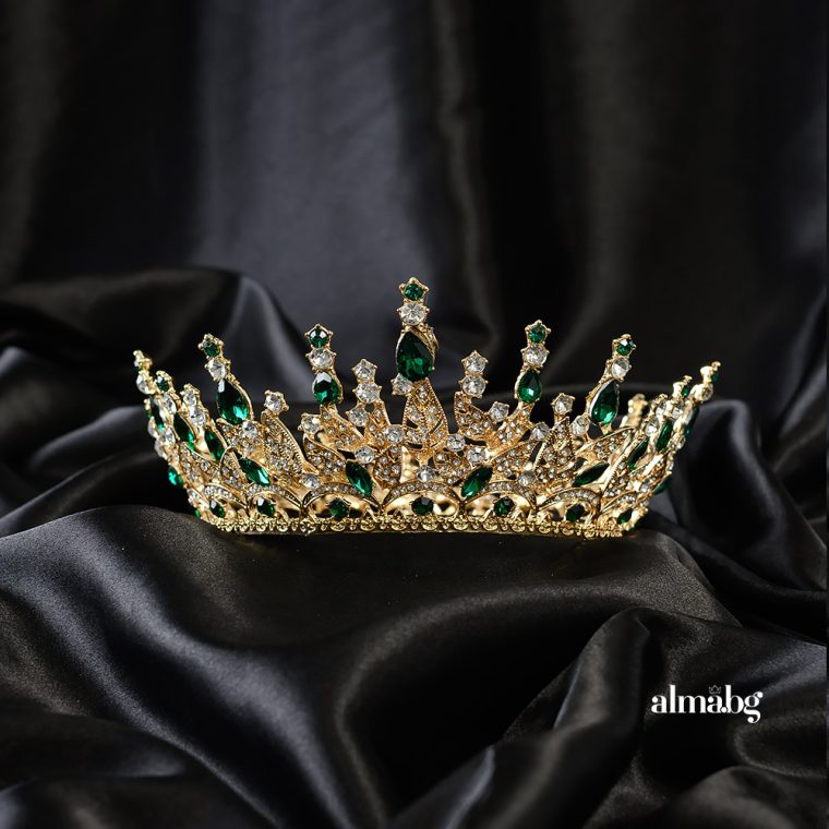 Crown with a golden base and green stones